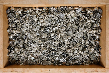 A group of Handmade sterling silver jewelry in the wooden box.