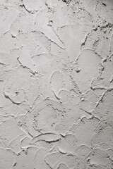 white concrete wall pattern in spatula technique