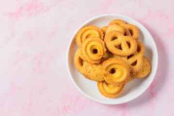 Set of danish butter cookies macro cutout. Five whole pretzel, round and rectangular shortbread biscuits with sugar