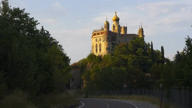 Iconic Rocchetta Mattei fortress seen from the road in Bologna region, Italy