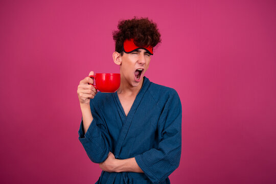 Retro style. A funny curly guy gets ready for his work day early in the morning. Pink background.