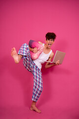 Retro style. A funny curly guy gets ready for his work day early in the morning. Pink background.