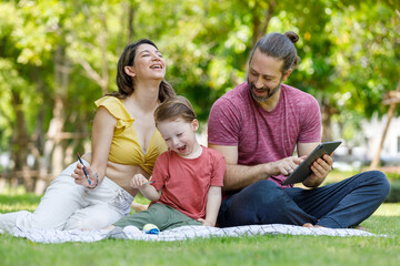 Fototapeta premium Happy family day, father, mother, son, Caucasian enjoying watercolor painting and picnic in nature.