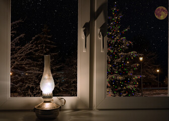 kerosene lamp on the windowsill