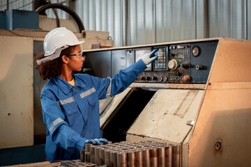 Engineer worker wearing safety uniform control operating and check controlled Lathe grinding...