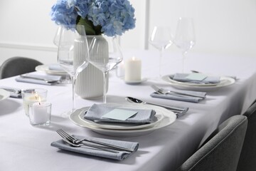 Beautiful table setting with floral decor indoors