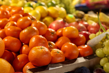 Many different fresh fruits on counter at wholesale market
