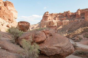 Charyn canyon located in the Almaty region of Kazakhstan, horizontal shot with a huge boulder in the foreground