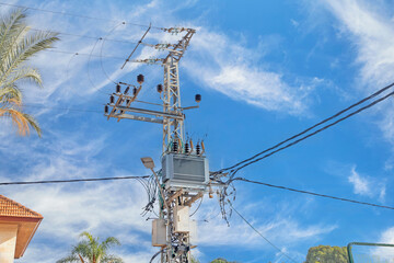 High voltage transformer on a pole.