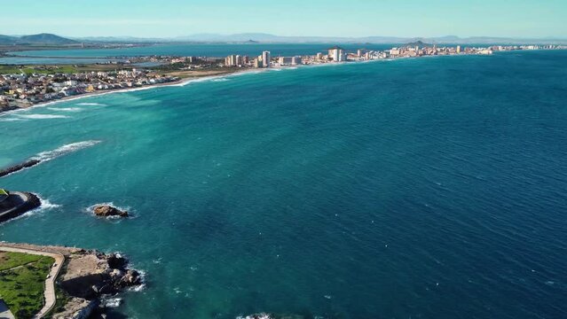 Panoramic aerial view of La Manga of Man Menor - "The Sandbar of the Minor Sea". A seaside sandspit of Mar Menor in the Region of Murcia Spain, 21 km long. Travel destination. Drone forward 