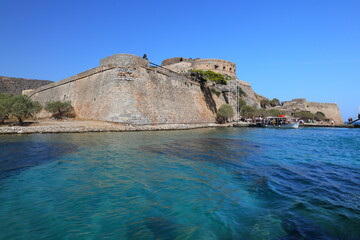 Spinalonga Island on a Beautiful sunny day showing the turqoius sea and blue sky. Crete, Greece, Europe.