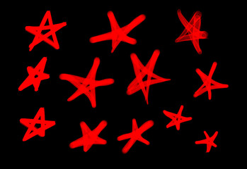 Collection of graffiti street art tags with star symbols in red color on black background