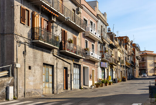 Cityscape at Via Lombardo street of Bronte town over Simeto river valley on western slope of Mount Etna volcano in Catania region in Sicily, Italy