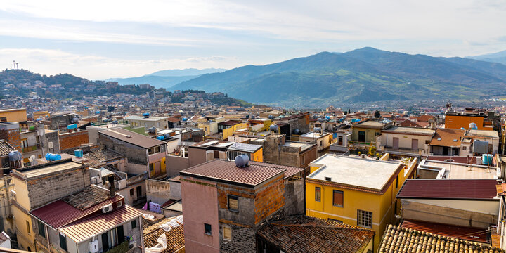 Panoramic view of Bronte town famous for Sicilian Pistachio over Simeto river valley on western slope of Mount Etna volcano in Catania region in Sicily, Italy