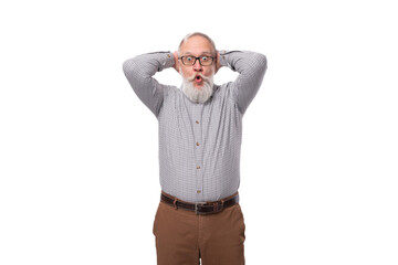 a gray-haired mature man with a beard and mustache in trousers and a shirt is surprised