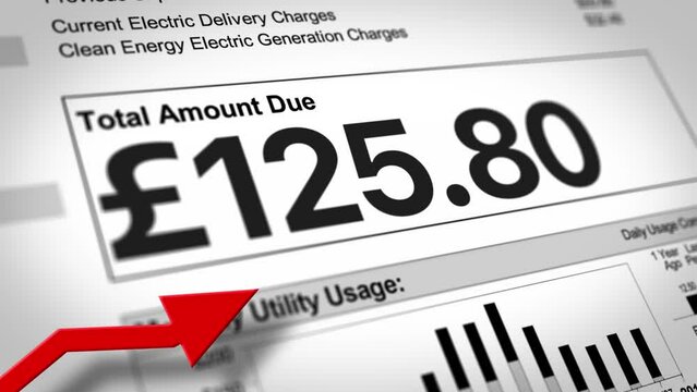 A close-up view of a UK household electric utility bill rising. Increased cost of living concept. British pound sterling version.  	
