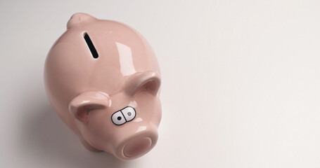 Pink piggy bank - financial concept. Saving money, budgeting