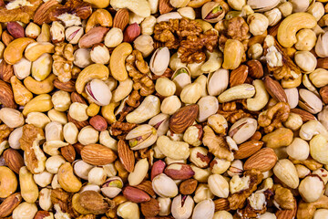 Background of the various nuts (almond, cashew, hazelnut, pistachio, walnut). Vegetarian meal. Healthy eating concept