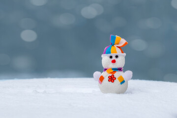 Christmas snowman on snowy background.Greeting card for Merry Christmas and New Year holidays.