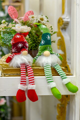 a sitting Santa Claus toy on a New Year's background