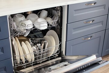 Open dishwasher with dirty dishes