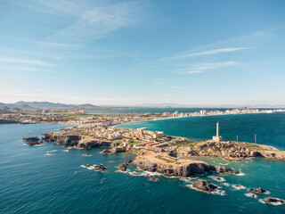Aerial drone perspective of famous region La Manga, Murcia Province. Spain. "Cabo de Palos" - Cape Palos. La Manga city in background. Beautiful panorama of all region. European Travel Destination