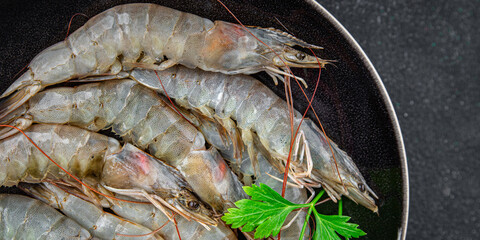 shrimp raw prawn seafood fresh eating cooking appetizer meal food snack on the table copy space food background rustic top view Pescetarian