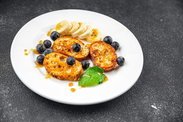 sweet breakfast French toast berrie, banana pancake fresh cooking meal food snack on the table copy space food background rustic top view
