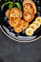 sweet breakfast French toast berrie, banana pancake fresh cooking meal food snack on the table copy space food background rustic top view