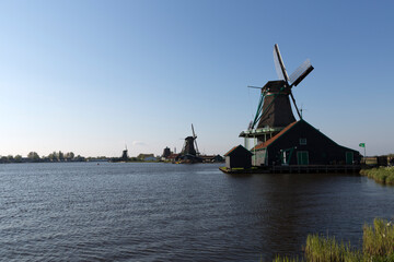 Fototapeta na wymiar Netherlands windmills Zaanse Schans on a sunny autumn day