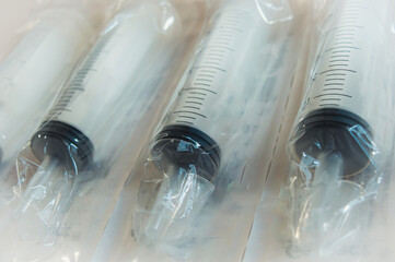Disposable syringe barrel with plunger, dosage scale. Also known as gavage syringe or feeding...