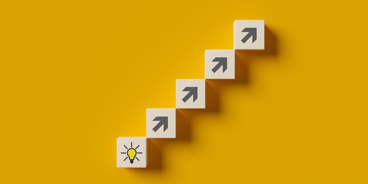 Steps from wood blocks with arrows leading to light bulb symbol on blue background flat lay from above, idea or innovation or solution business concept