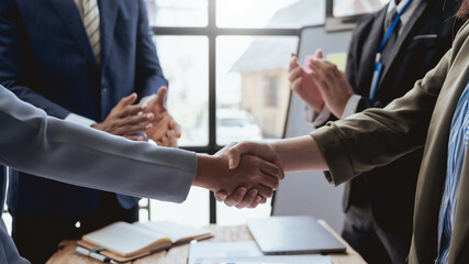 Successful negotiation, handshake. Businessman shake hand with partner to celebration partnership and business deal. - obrazy, fototapety, plakaty
