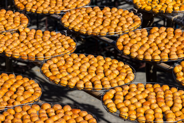 Dry Persimmon fruit production under sunshine in factory