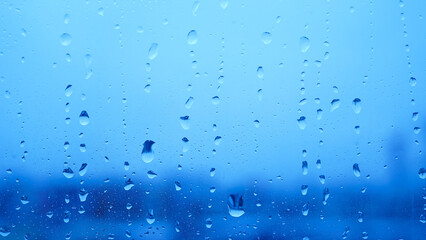 Condensation on window glass in frosty winter weather. Background in the form of small drops on the glass