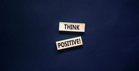 Think positive symbol. Concept words Think positive on beautiful wooden block. Beautiful black table black background. Business, motivational think positive thinking concept. Copy space.