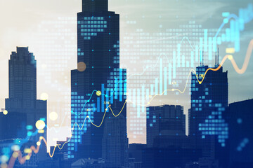 Creative glowing candlestick forex chart on blurry city texture. Trade, finance and stock concept. Double exposure.