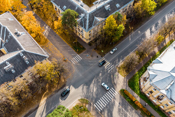 Unregulated road intersection, autumn cityscape from the air