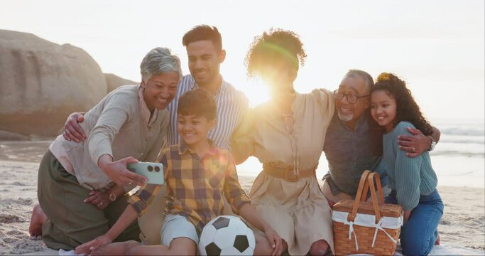 Selfie, happy family and beach with love, care or support in nature together. Sunset, profile picture and kids with parents, grandparents or bond at the ocean picnic for sundown travel, trip or games