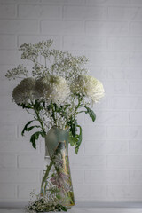 bouquet of white chrysanthemums and gypsophila paniculata