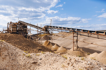 Banner Sand quarry, Industrial plant with belt conveyor in open pit mining. Construction site,...