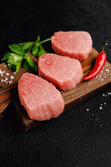 Raw Steak Fresh meat veal fillet on wooden board, dark background top view