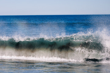 Landscape of Khalaktyrsky beach with black volcanic sand coast of North Pacific Ocean Kamchatka Russia