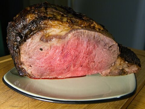 Beef prime rib roast in stages of preparation