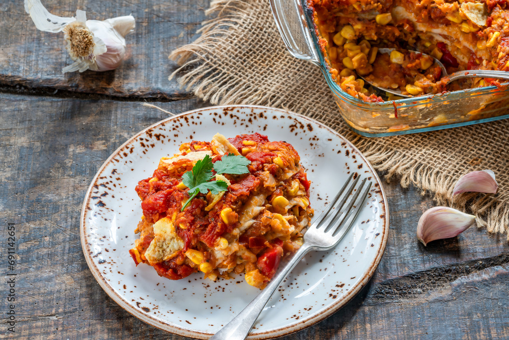 Wall mural Vegetarian enchilada bake with smoky lentils and sweetcorn