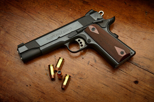 Colt 1911 XSE Government Enhanced Competition. .45 caliber semi-automatic handgun with custom wood grips. 185 grain Federal Hi-Shok JHP ammunition.