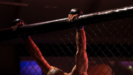 hands of an mma fighter clinging to the top of the octagon wall with his head down - 691152226