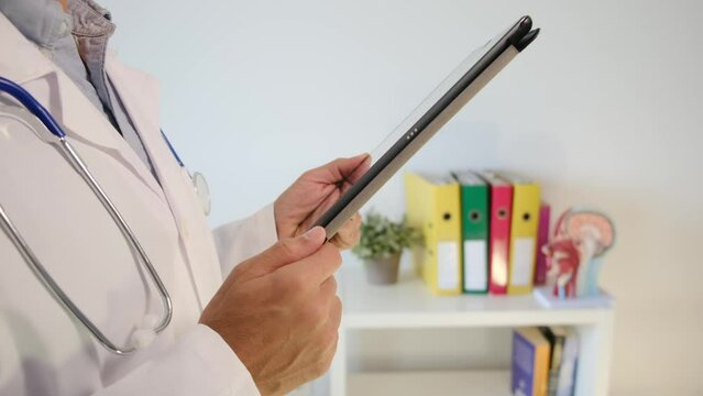 Experience the world of healthcare as a dedicated doctor in a hospital reviews a neuro image on a tablet, exploring test results. Immerse yourself in the concept of clinical medical care, neuroimaging