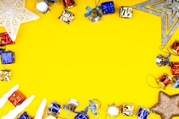 Christmas background. Copy space. New Year banner Template with gift boxes, stars, bells, toys, decorations. Bright Christmas frame. Winter holidays New Year. Top view photo for message or advertising