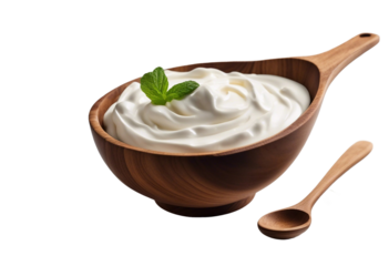 Sour cream in wooden bowl and spoon mayonnaise yogurt isolated on transparent or white background
